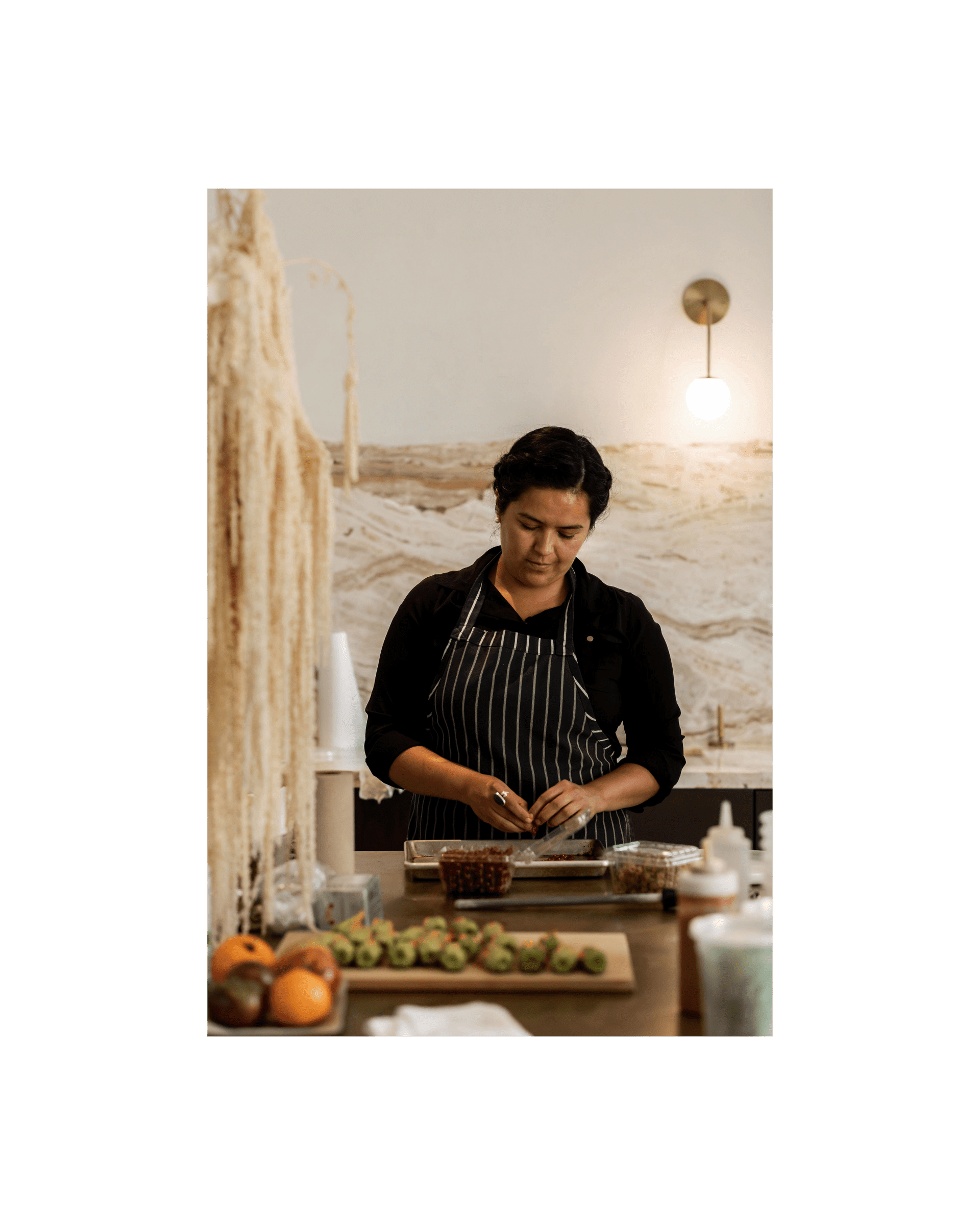 Chef Miriam Echeverria prepares food in the kitchen at Lune