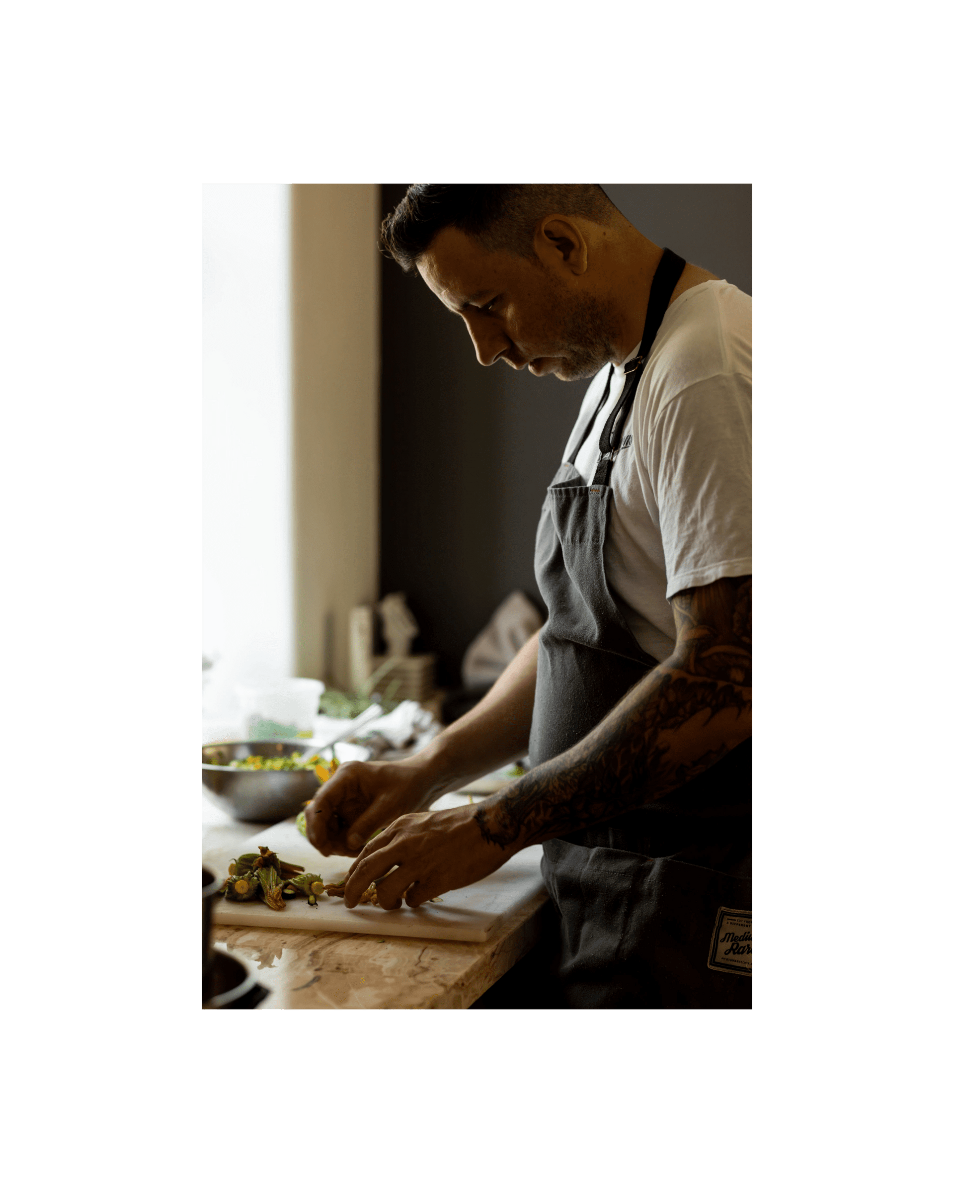 chef Kevin Castonguay preparing food in the kitchen at Lune