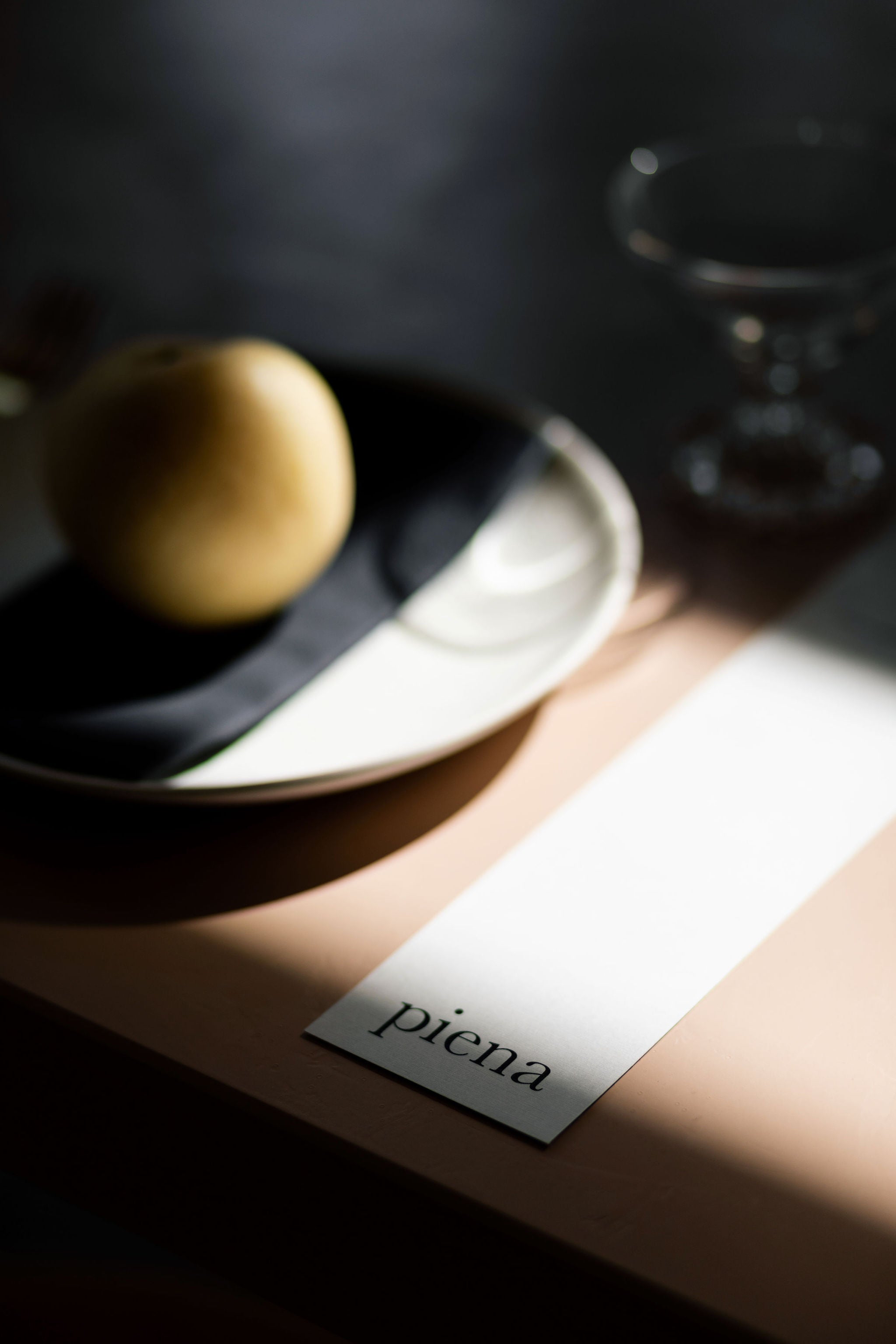 fruit sits on a plate beside a printed menu
