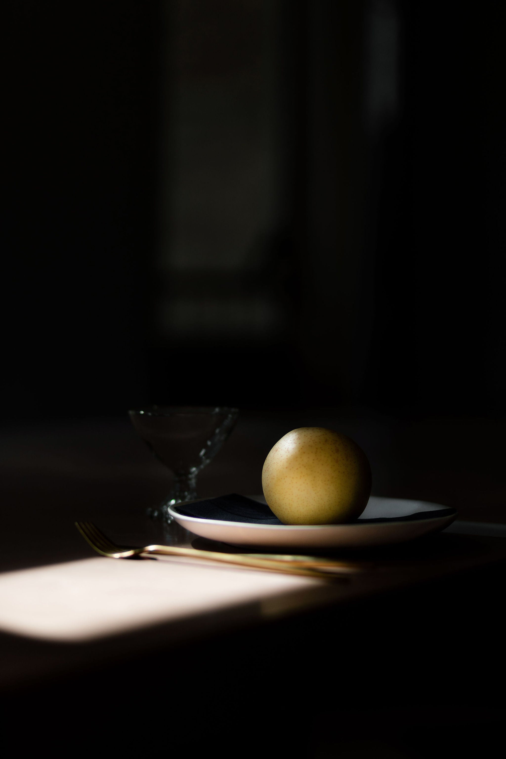 fruit sits on a plate in the sun