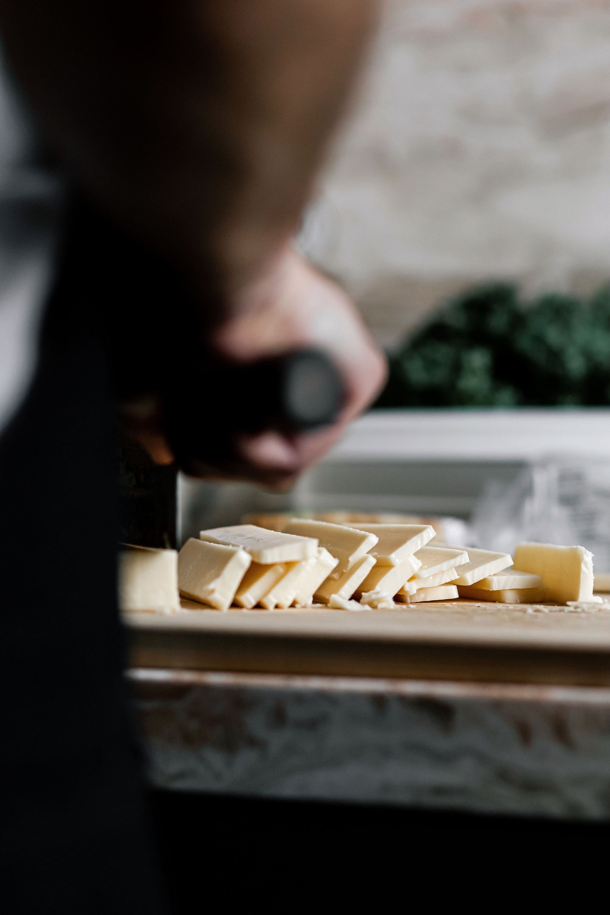 closeup of cheese being sliced