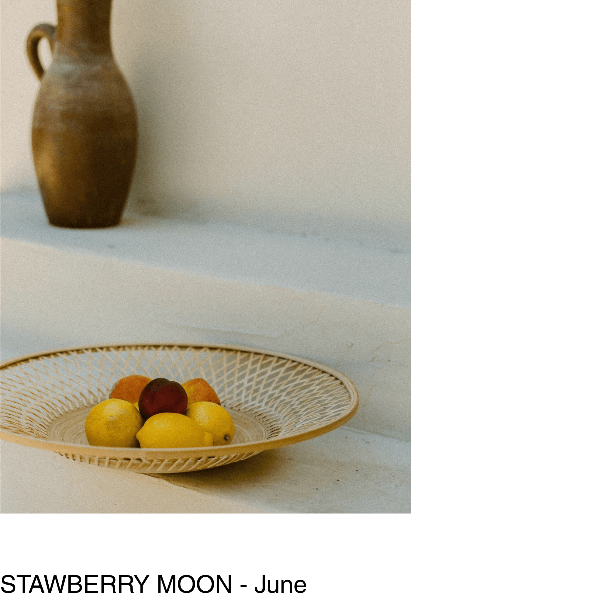 a fruit basket of lemons and peaches sits on white plaster steps