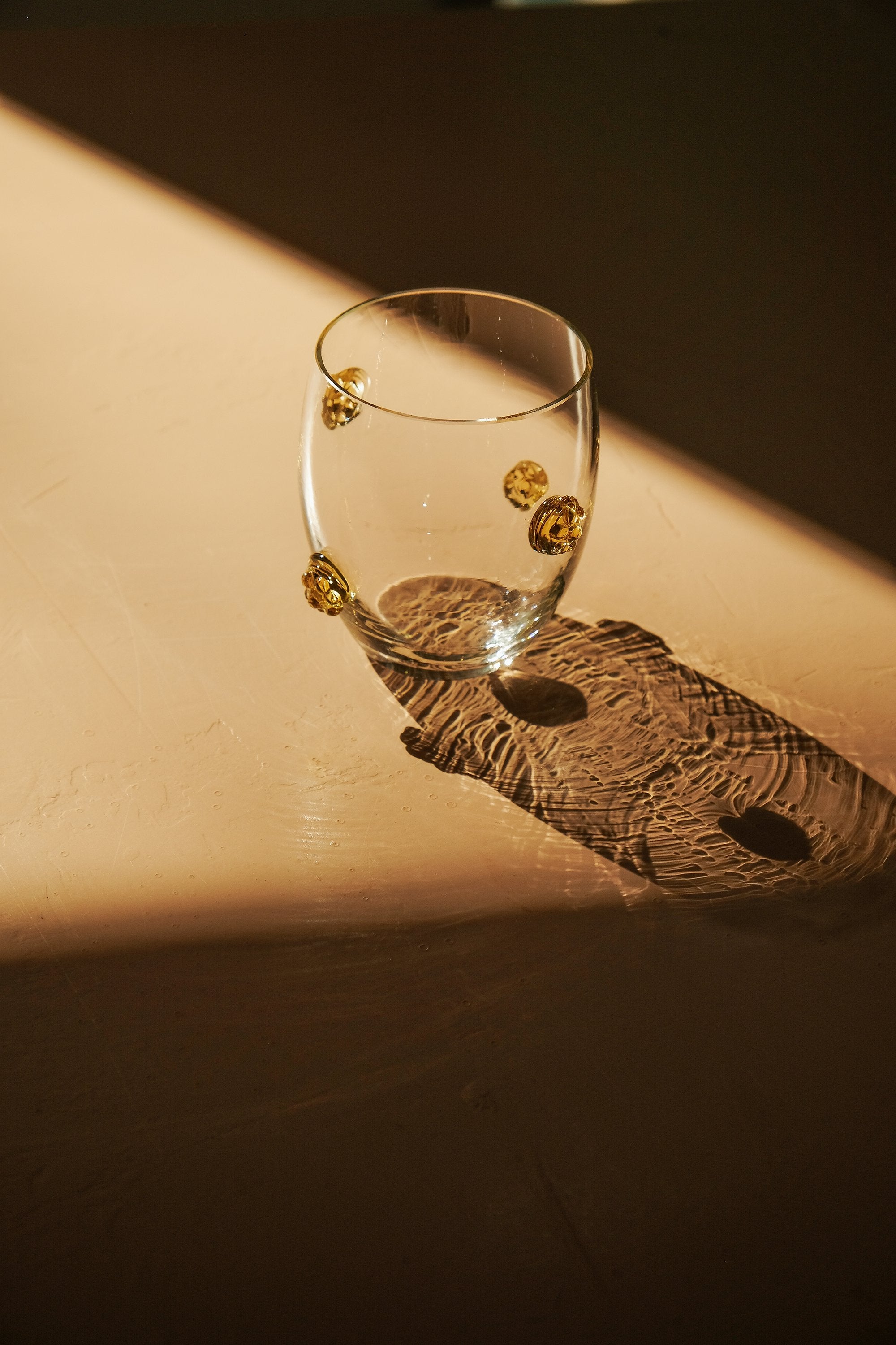 glass with hand blown rosettes