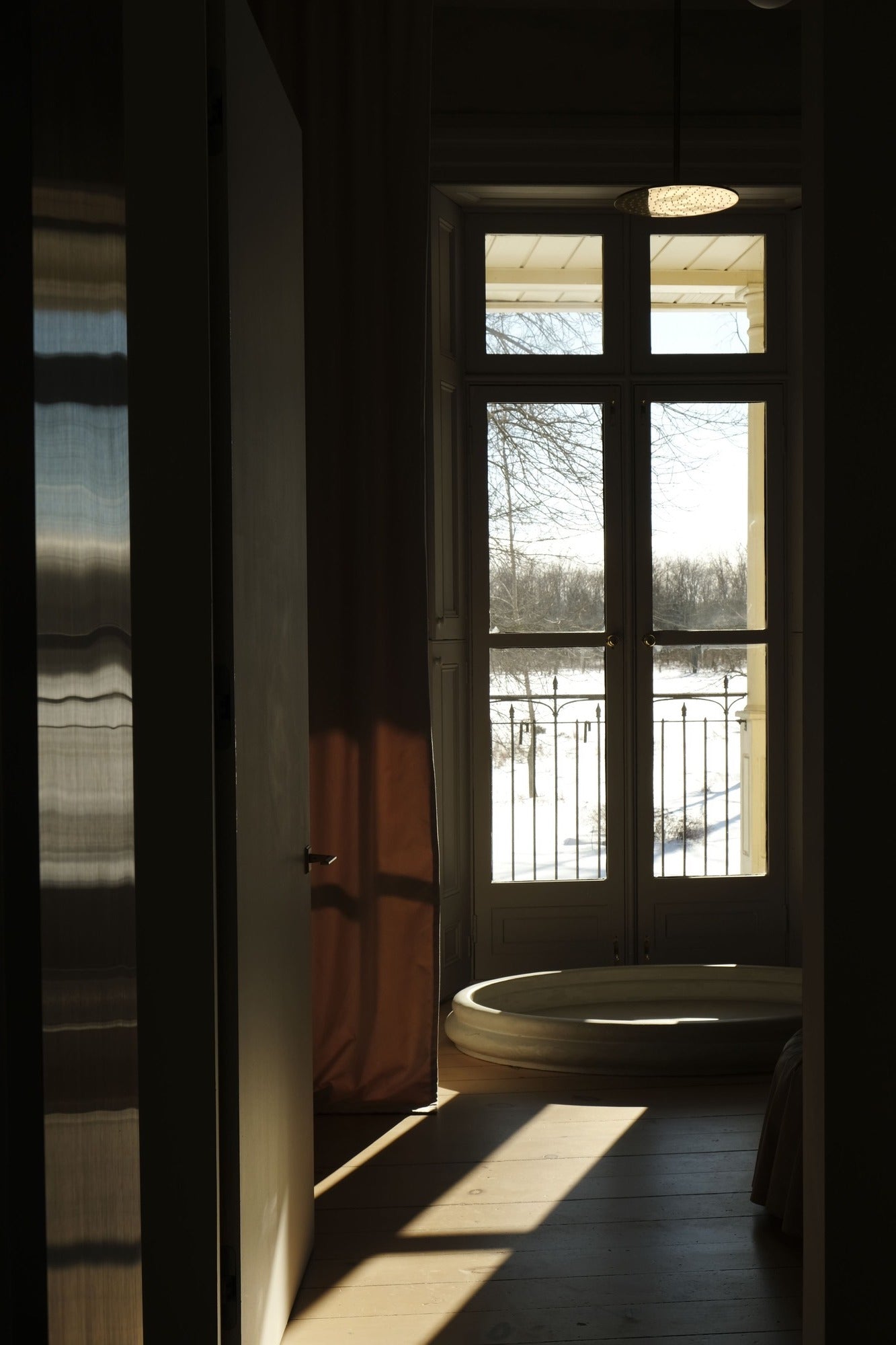 rain shower sits in front of french doors