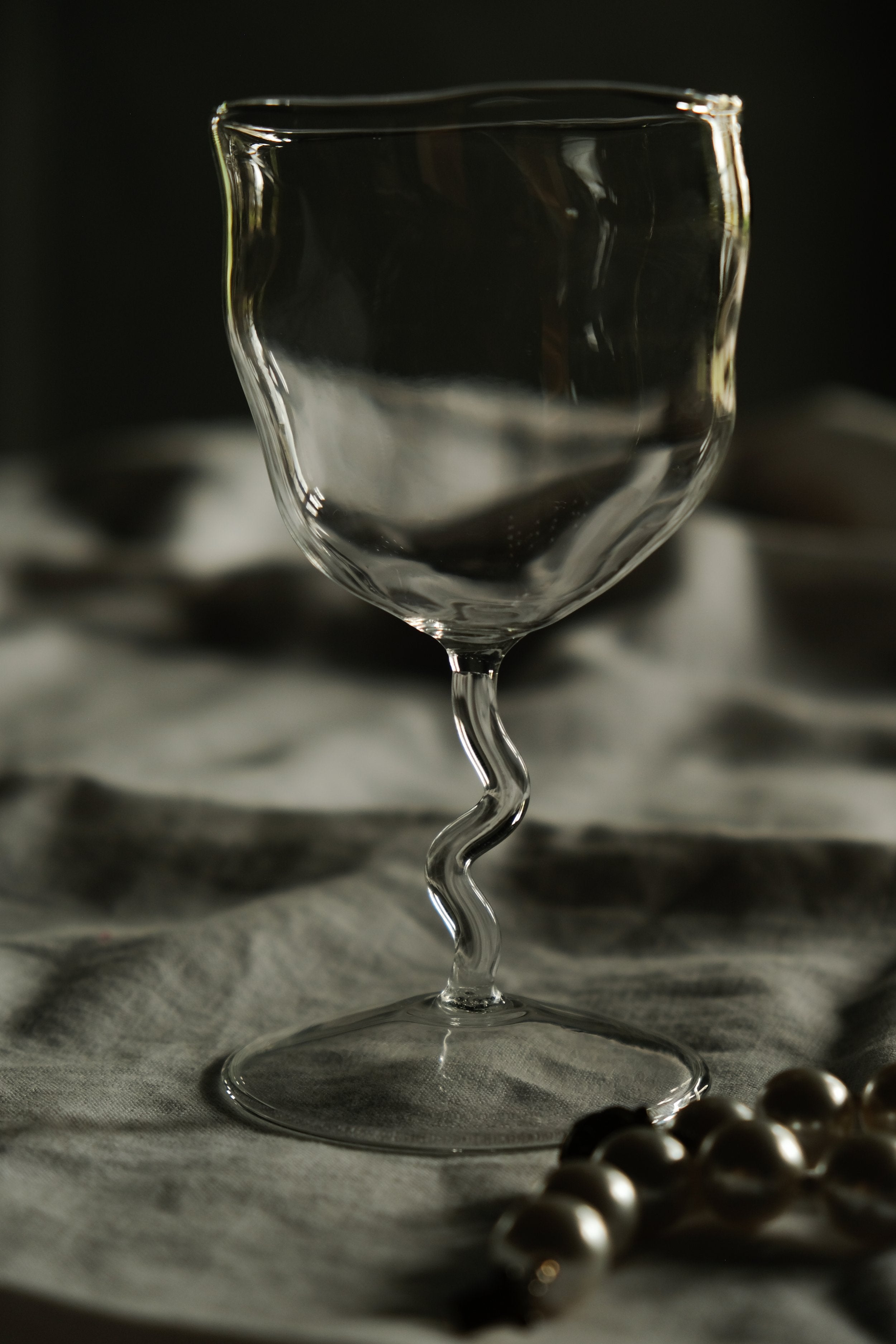 hand pressed wine glass with a fluid shape