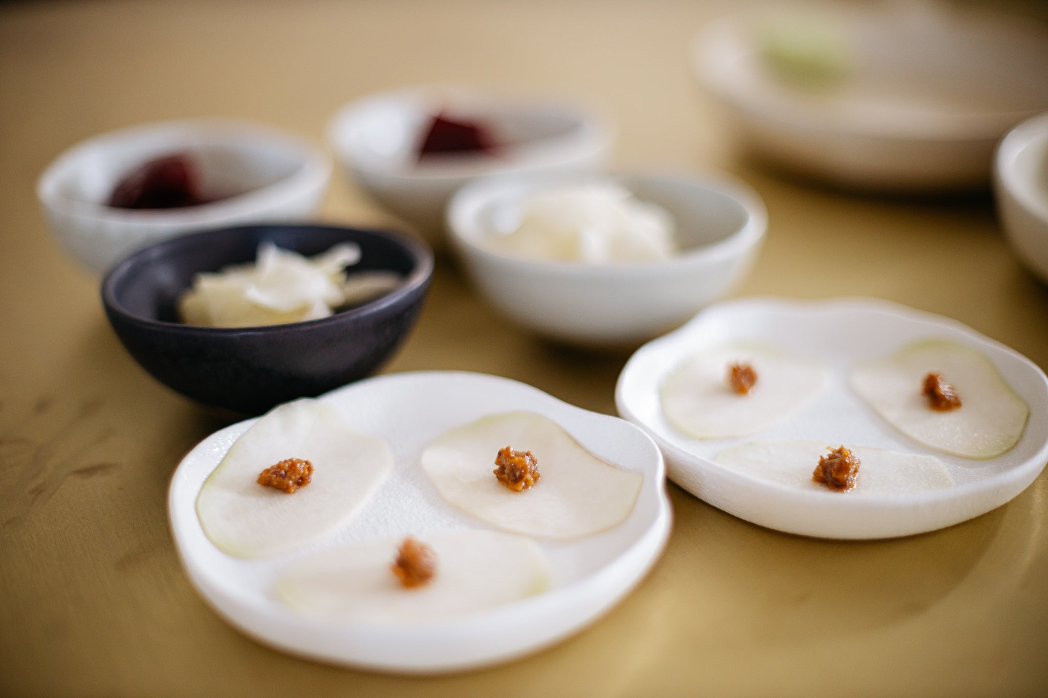 closeup of delicately sliced vegetables on plates