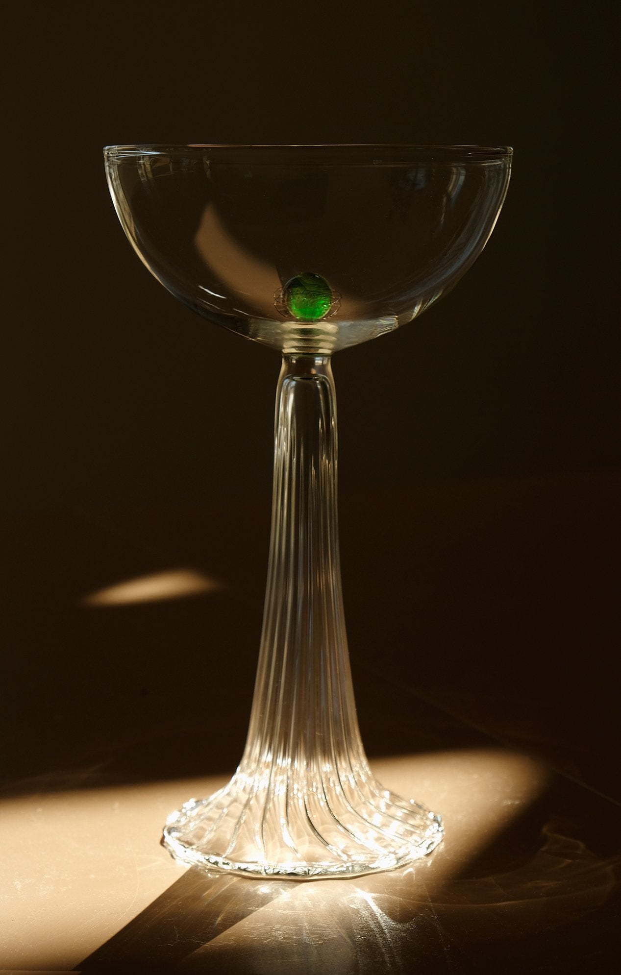 coupe glass with green glass detail