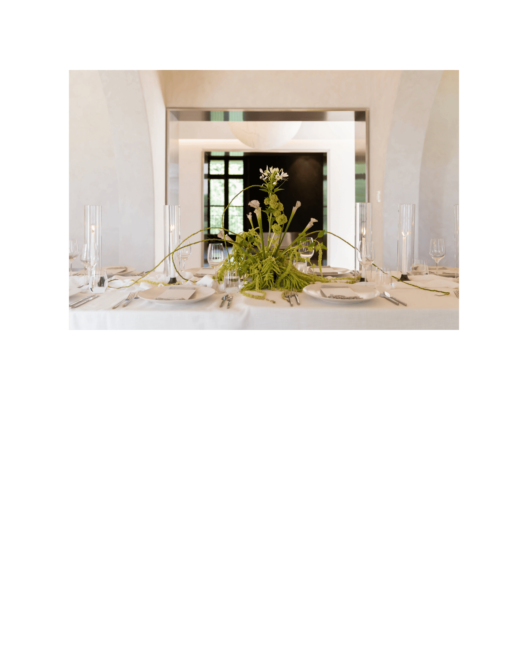 wedding table set with large floral arrangement